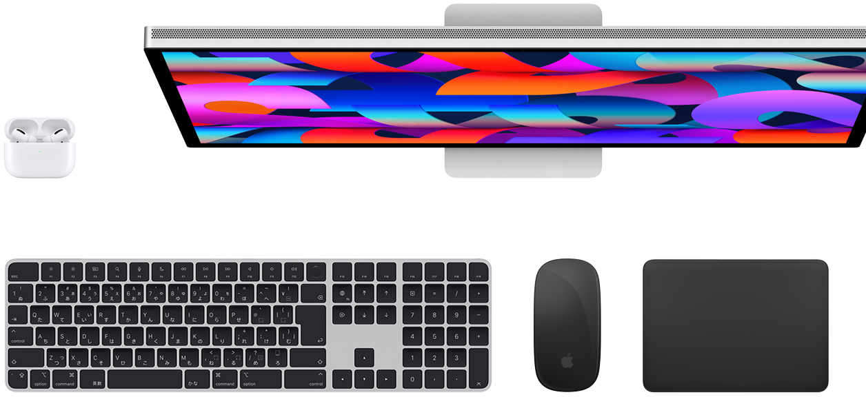 Top view of AirPods, Studio Display, Magic Keyboard, Magic Mouse, and Magic Trackpad