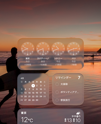 Liquid Glass Clock, Calendar, Reminders, and Weather widgets on macOS Tahoe screen over a scene of a surfer walking on the beach at sunset